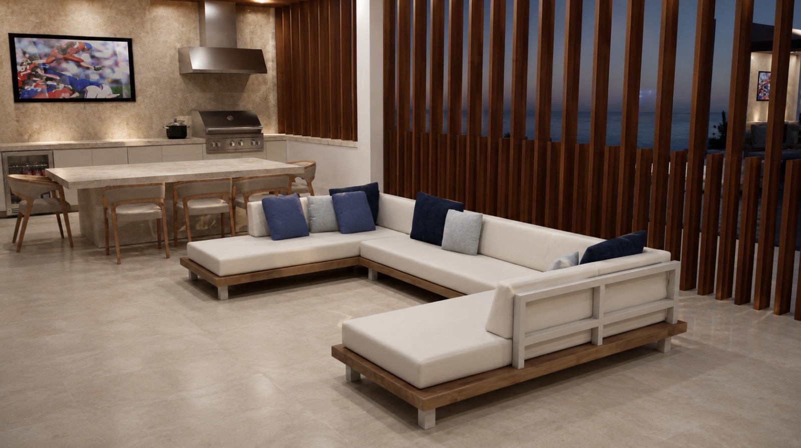Covered outdoor living space with wood finishes, lounge seating and built-in kitchen